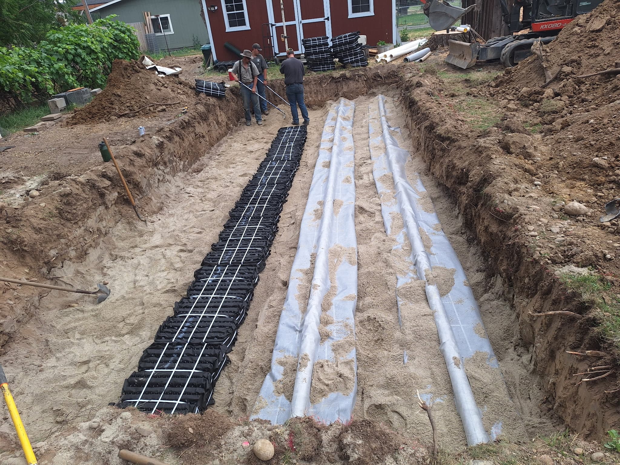 Drainfield chamber rows set in sand during an Idaho residential installation.
